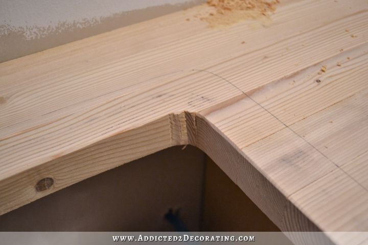 close up of DIY butcherblock countertop with hole for undermount sink - rough cut before sanding