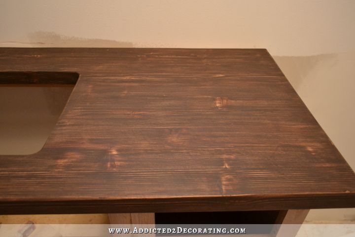 DIY butcherblock style countertop staind dark with multiple layers of dark stains with sanding between coats