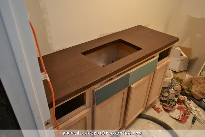the finished DIY butcherblock style countertop for an undermount sink, stained in a dark walnut wood stain