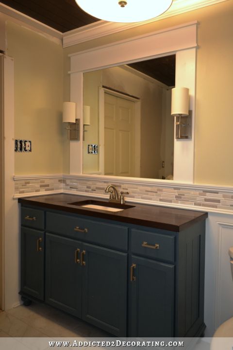 Framed bathroo mirror with integrated sconces - 1