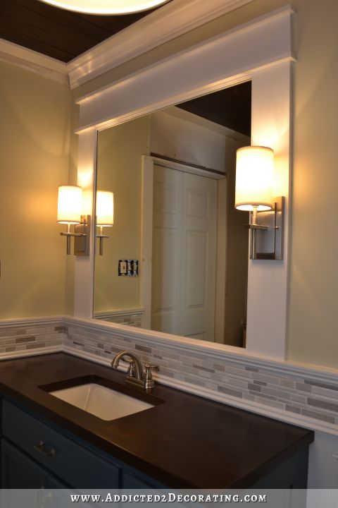 Framed bathroo mirror with integrated sconces - 8