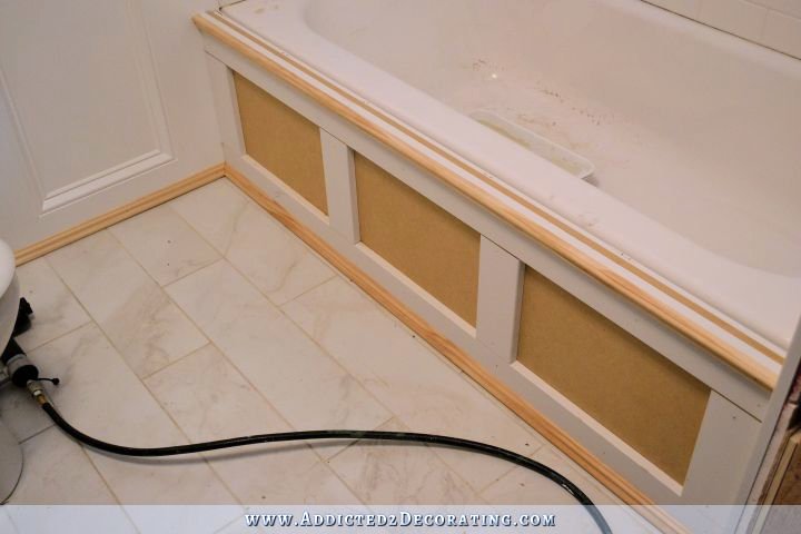 DIY tub skirt - step 5 - add vertical trim and decorative moulding along top and bottom