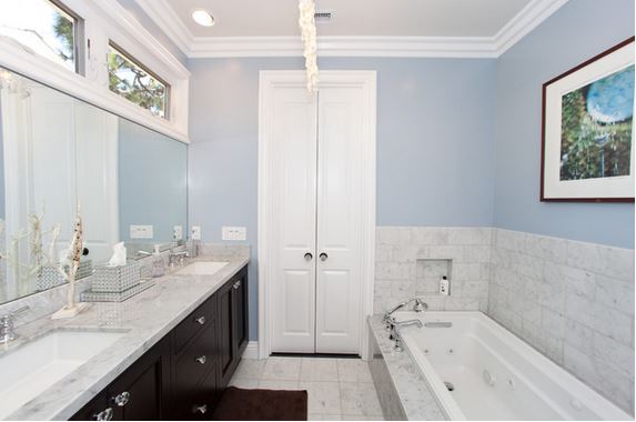space saving idea for a small bathroom - small doors hung like French doors in standard width doorway - bathroom designed by Globus Builder, via Houzz