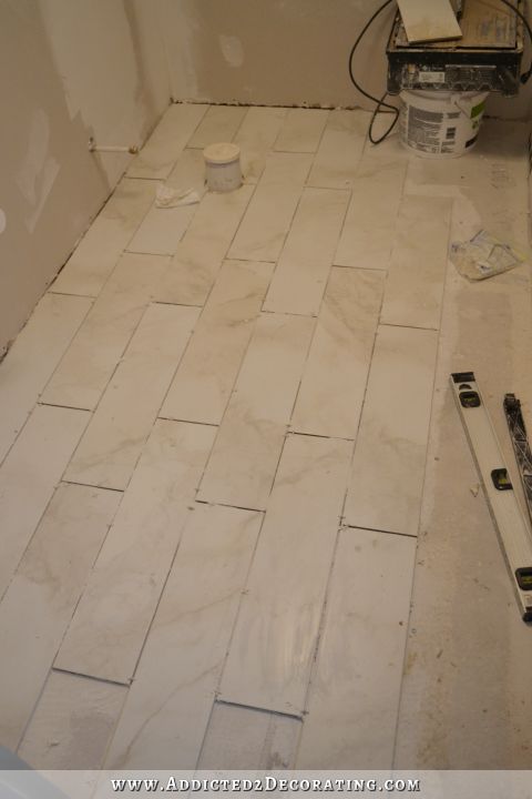 tiled and grouted bathroom floor - 1