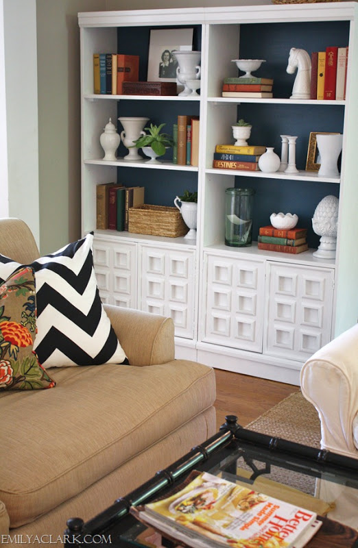 white living room bookcase with dark blue back, from Emily A. Clark