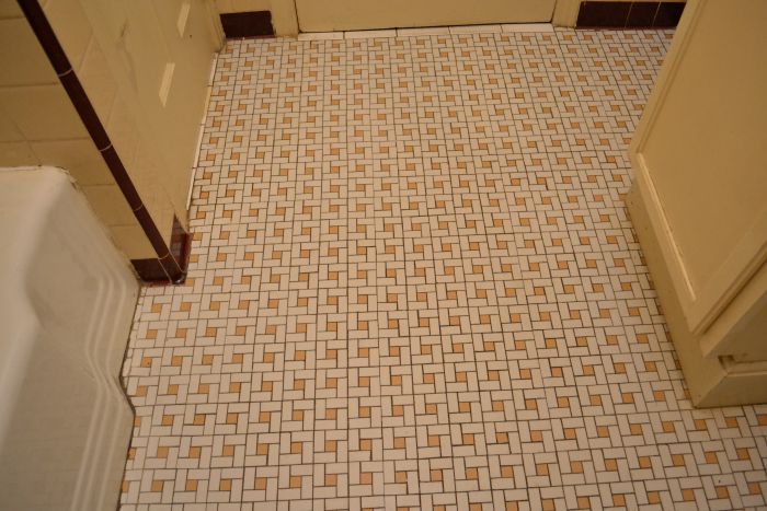 original pink and white mosaic tile floor in late 1940s / early 1950s bathroom