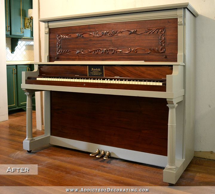 100 year old upright piano with refinished walnut veneer and gray painted frame - after 2