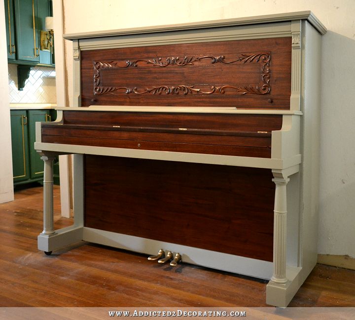 100 year old upright piano with refinished walnut veneer and gray painted frame
