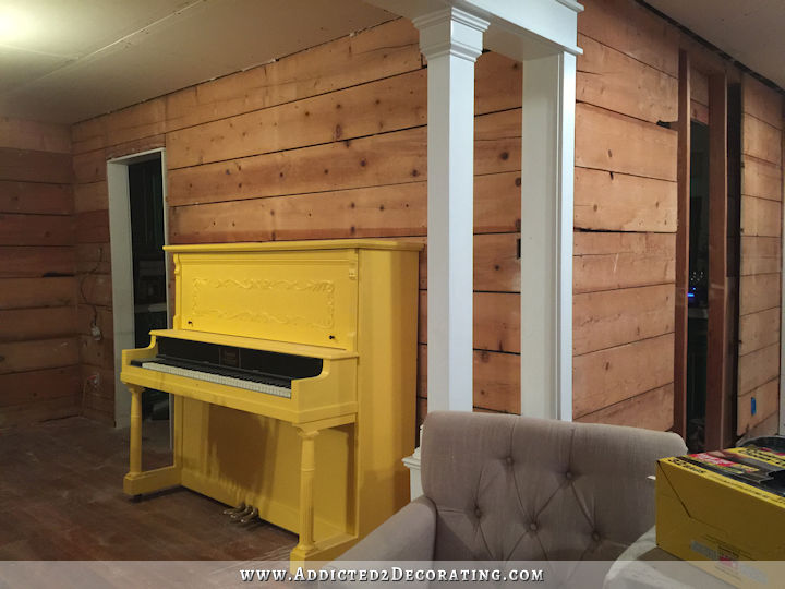 music room walls with drywall removed and shiplap exposed