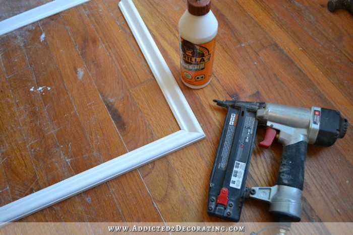 Assemble molding pieces with wood glue and finishing nailsl - How to install picture frame moulding wainscoting - addicted2decorating.com