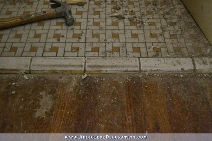 hallway bathroom - tiled floor demolition 1