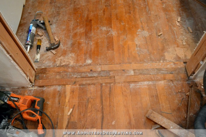 repairing hardwood floor in new doorway - 5