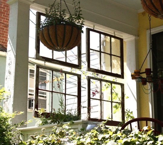 ways to repurpose old windows - space divider on front porch via Apartment Therapy