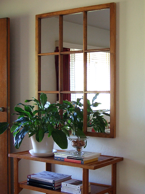 ways to repurpose old windows - turn a window into a decorative wall mirror, via Craftynest