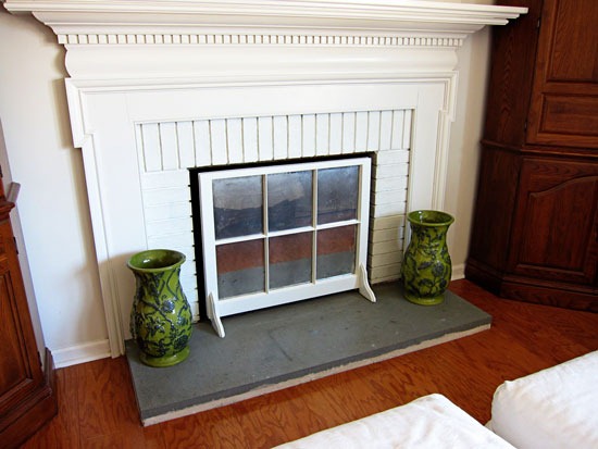 ways to repurpose old windows - turn a window into a fireplace screen, via In My Own Style blog