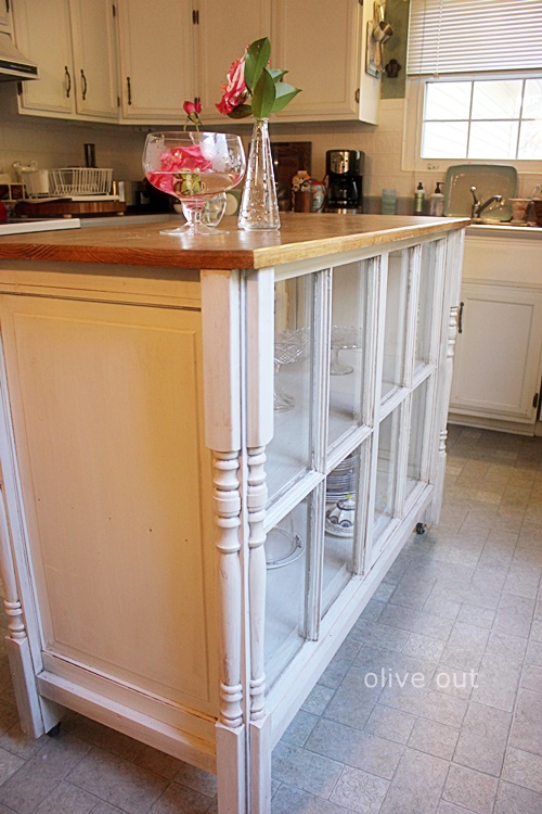 ways to repurpose old windows - use as front of kitchen island, via Olive Out