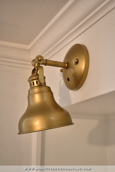 music room pocket door bookcases with brass sconces - 4