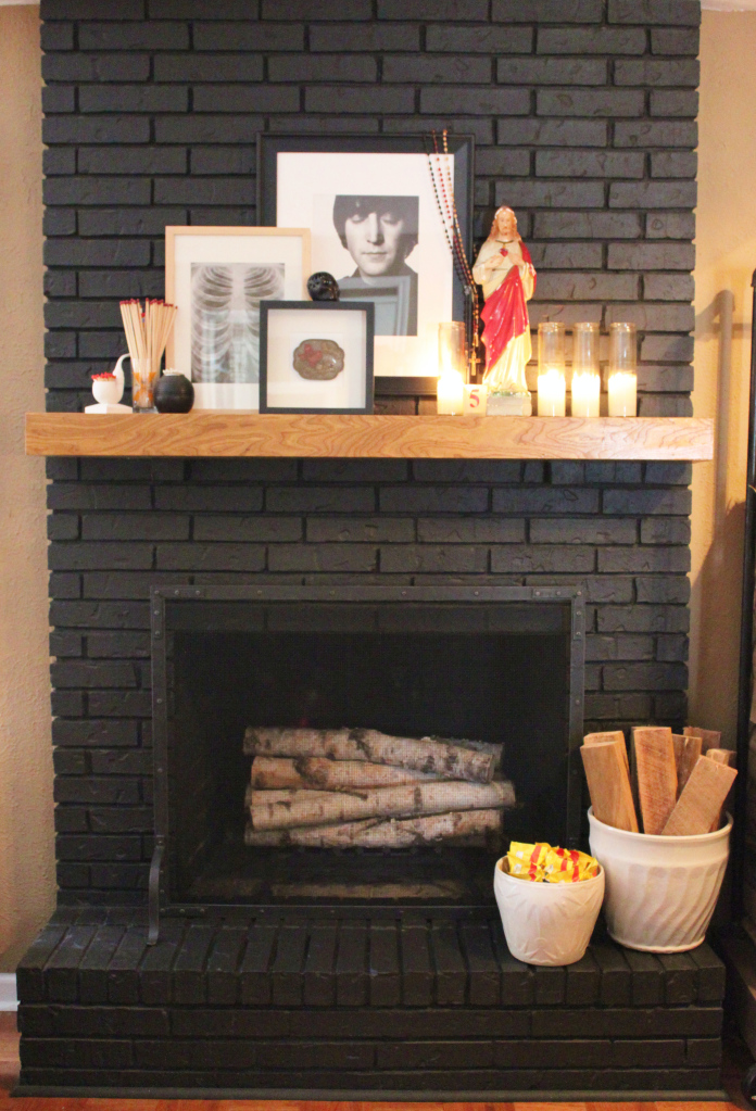 Black painted fireplace via The Cavender Diary