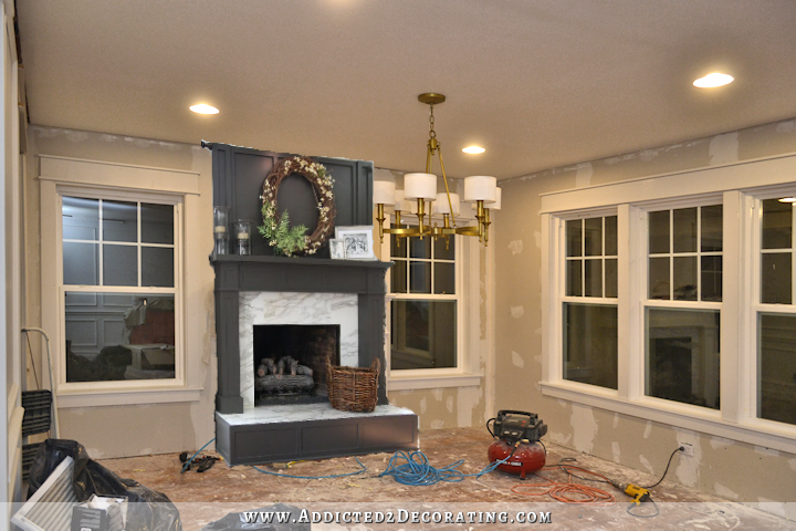 dinin room with a dark gray fireplace