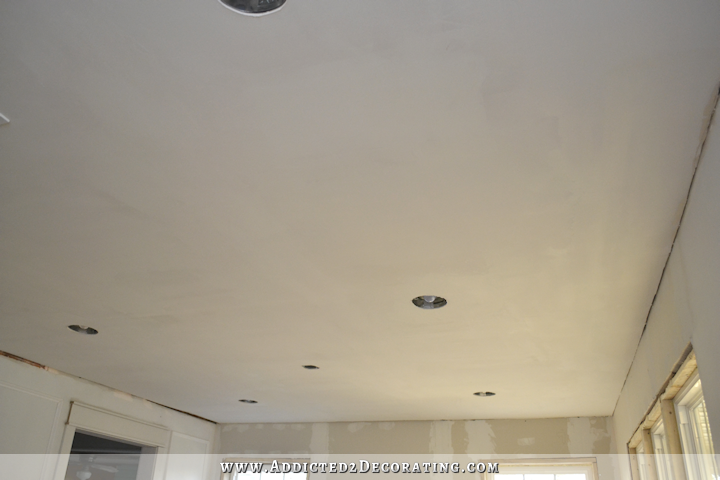 dining room and entryway with new taped and mudded drywall ceilings