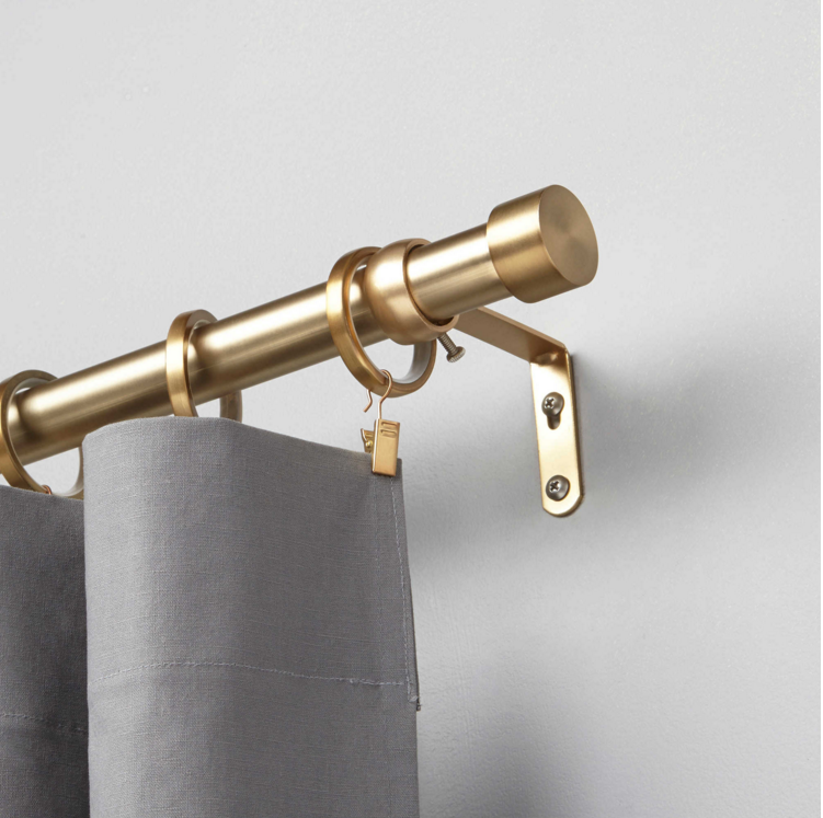 umbra curtain rod in brushed brass from Bed Bath & Beyond