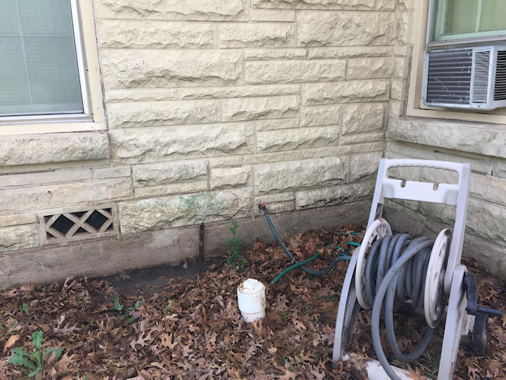 stone on house after pressure washing