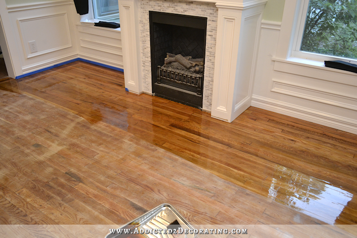 hardwood flooring with paint overspray and spills - refinishing with new coats of Waterlox - 1
