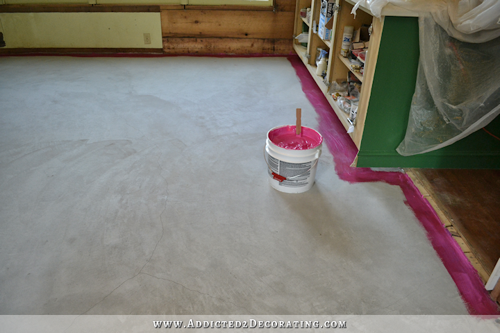 Breakfast room subfloor - moisture barrier on concete slab using RedGard - paint around edges with a brush