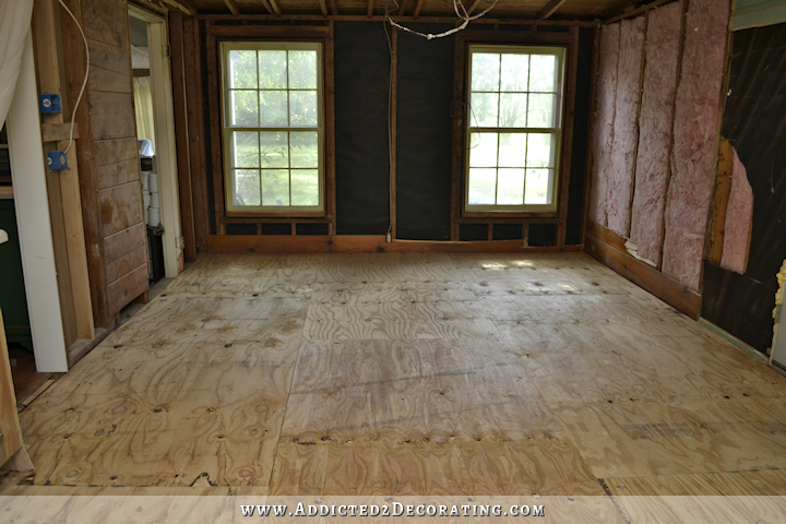 Breakfast room subfloor - plywood nailed and adhered to concrete slab in prepearation for nail down solid hardwood flooring - 1