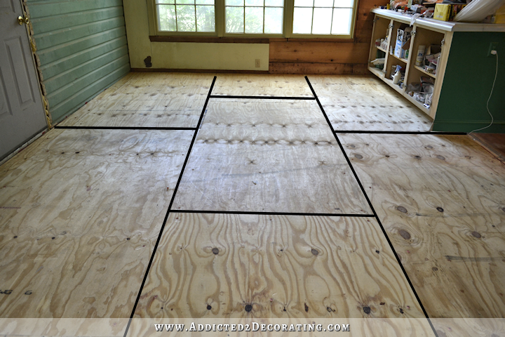 Breakfast room subfloor - plywood nailed and adhered to concrete slab in prepearation for nail down solid hardwood flooring - plywood pattern staggered