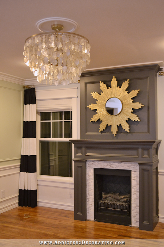 living-room-progress-with-newly-painted-fireplace-and-capiz-shell-chandelier-from-horchow