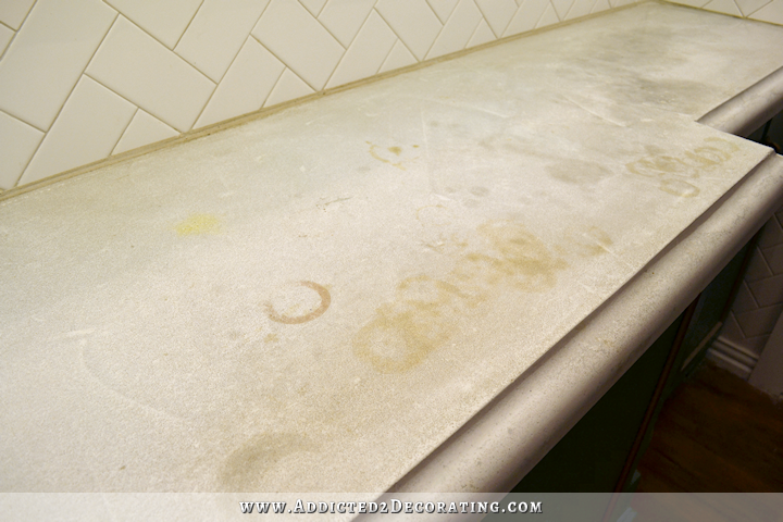 white concrete countertop in kitchen stained after two years of use