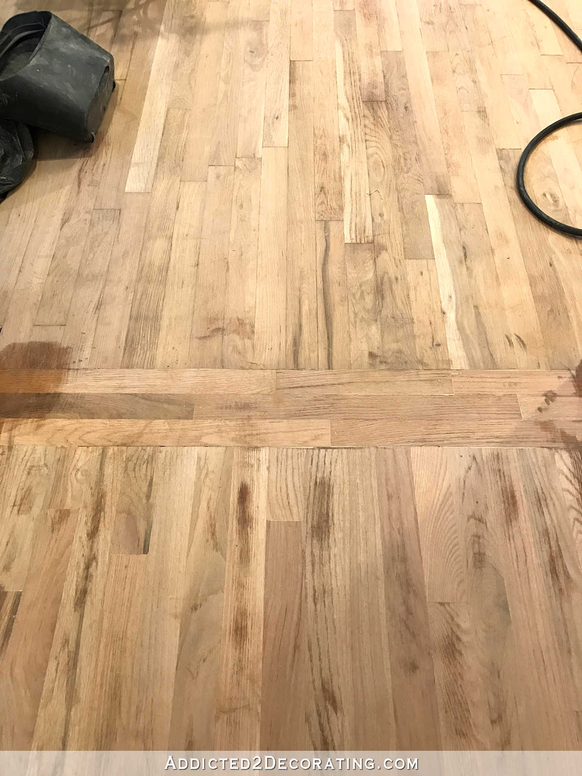 red oak hardwood floors sanded before staining - kitchen to living room