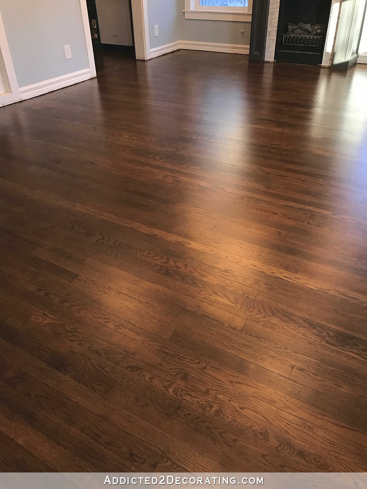 refinished red oak hardwood floors - entryway and living room