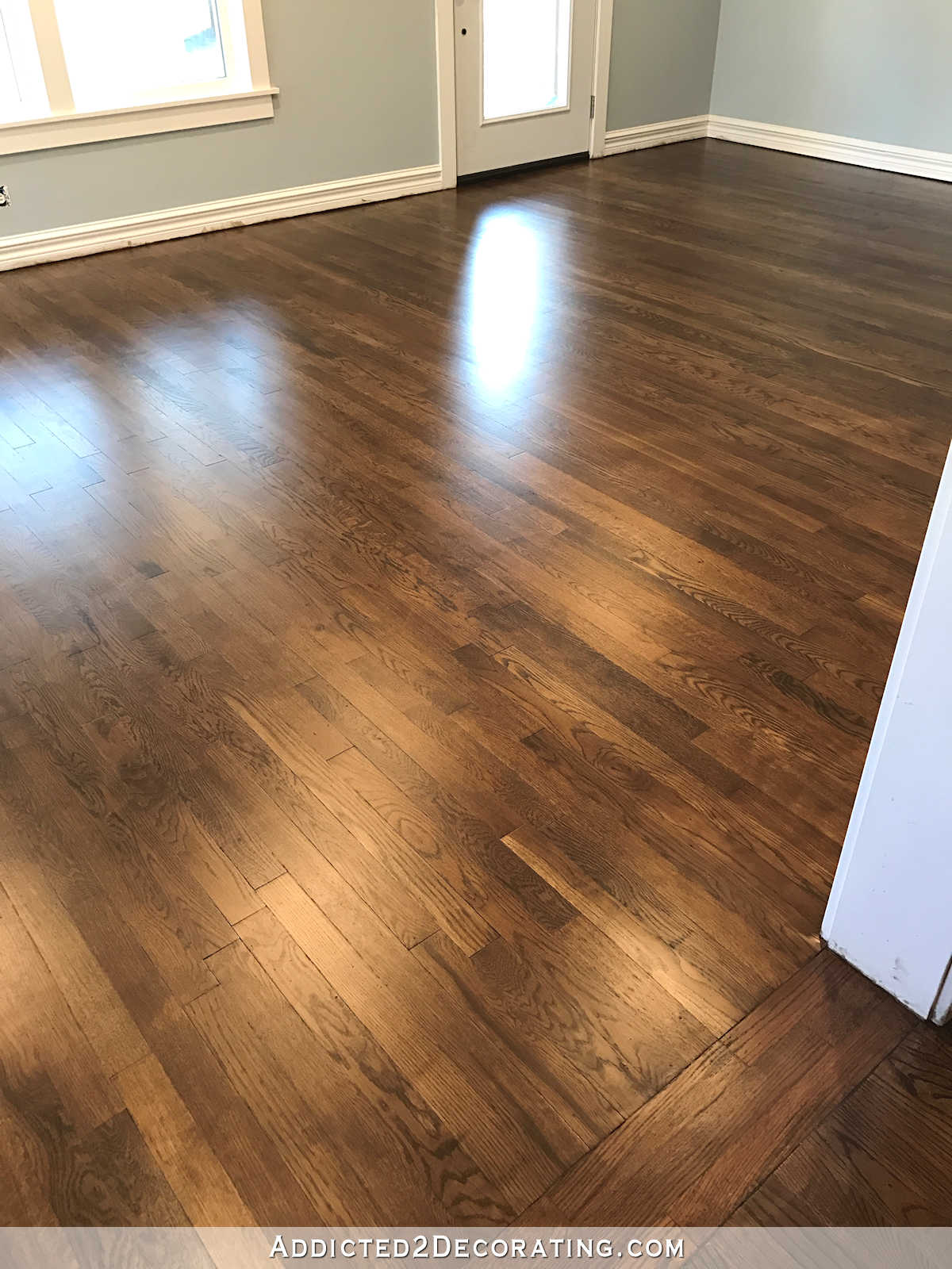 refinished red oak hardwood floors - living room and entryway