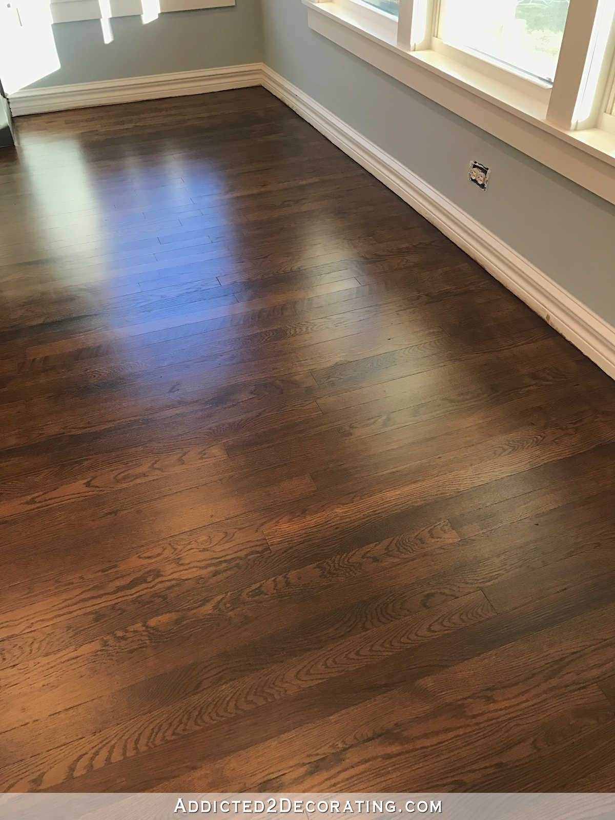 refinished red oak hardwood floors - living room by the windows