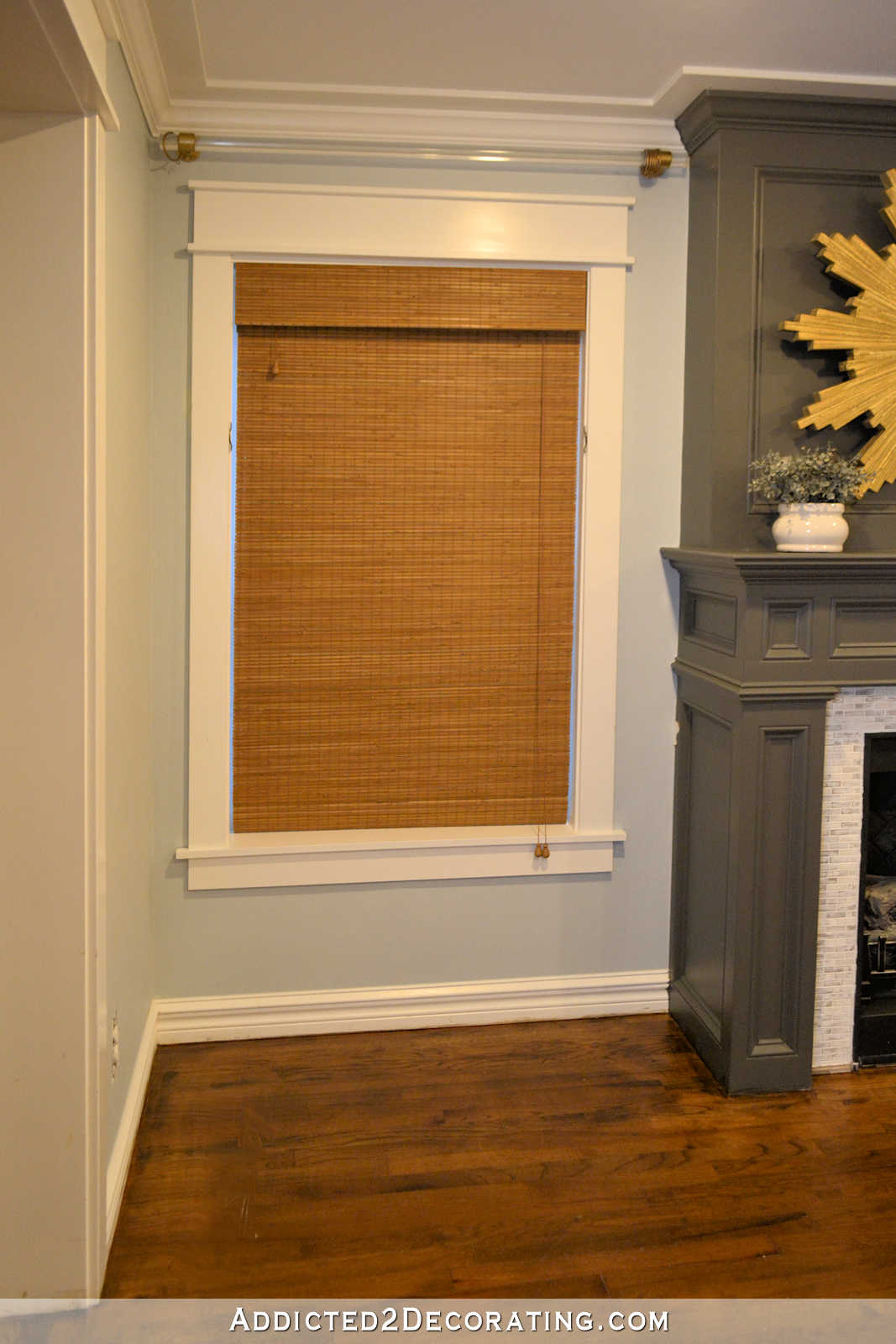 new woven shades from Blindsgalore - living room - window to left of fireplace - shade closed