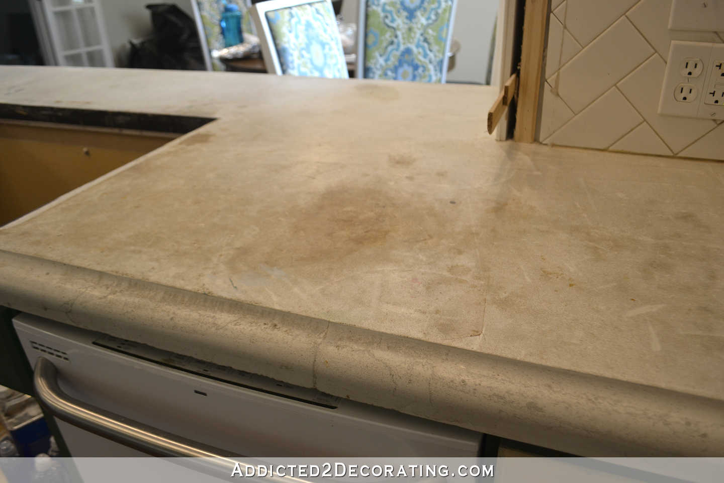 refinishing concrete countertops - 1 - concrete countertops before refinishing - stains on peninsula by sink area