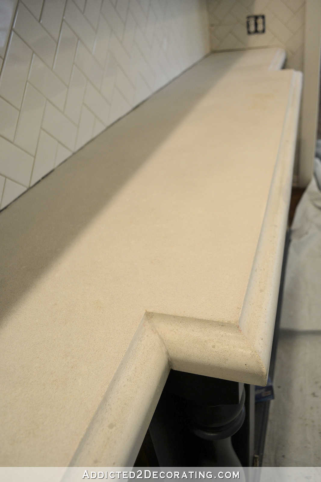 refinishing concrete countertops - 8 - concrete countertops after grinding and sanding - countertop on back wall