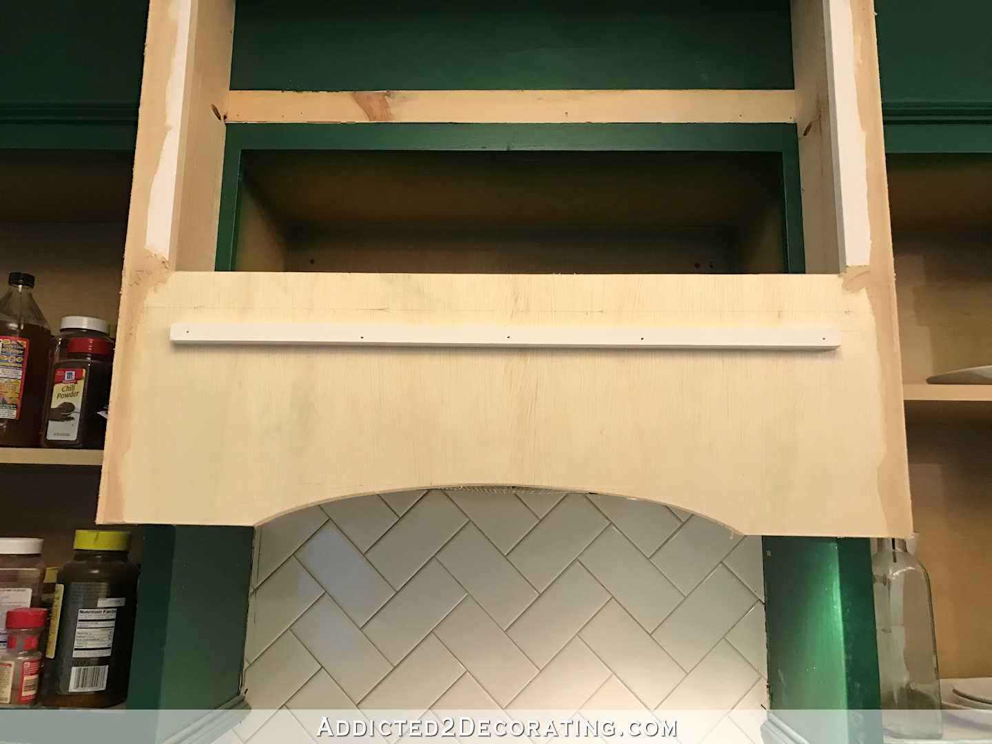 how to build a custom wood range hood cover - 23 - strip of wood attached to the range hood cover