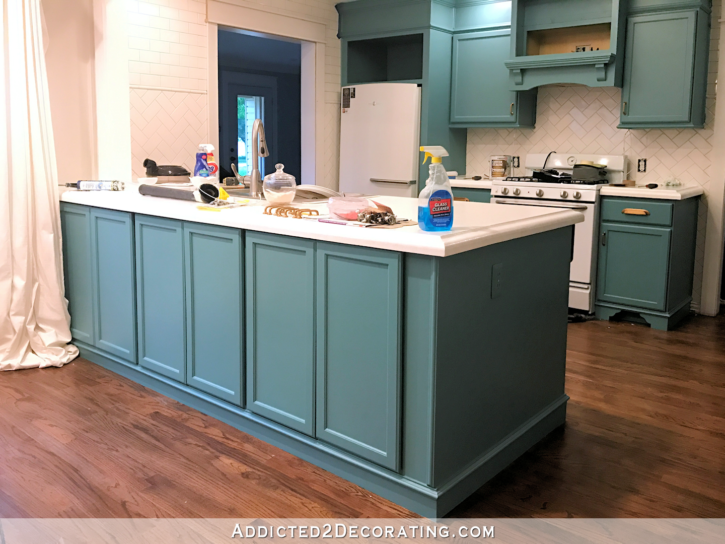 teal kitchen cabinets - breakfast room side of peninsula
