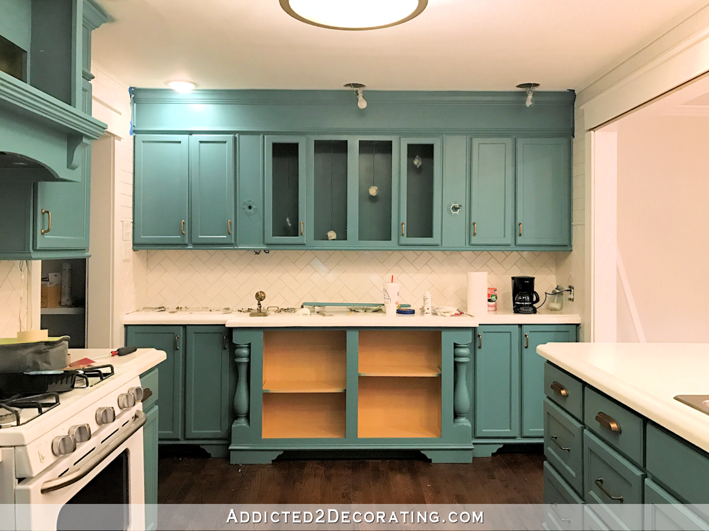 teal kitchen cabinets - wall of cabinets