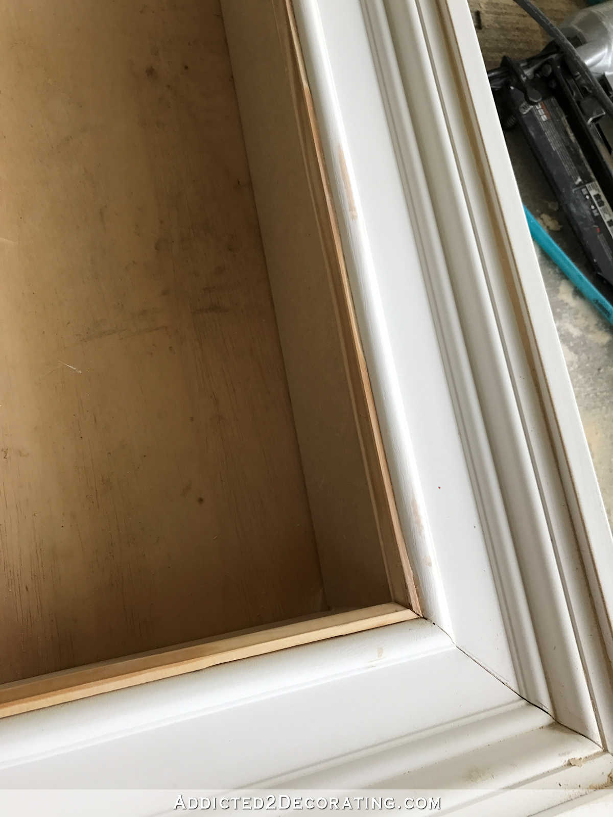 how to build an easy DIY frame for a wall mounted flat screen tv - 10 - add moulding to the area where the box meets the frame