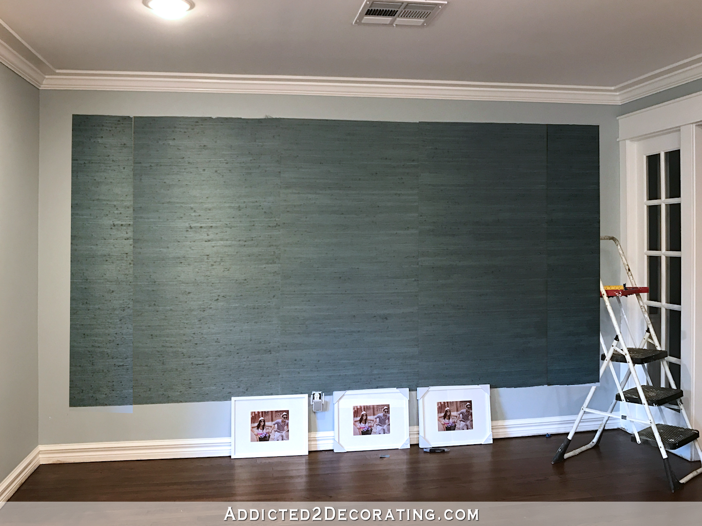 grasscloth accent wall in entryway - four pieces of wallpaper