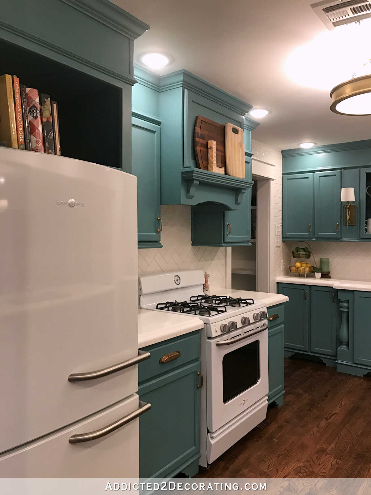 teal kitchen - range and refrigerator wall from the living room doorway