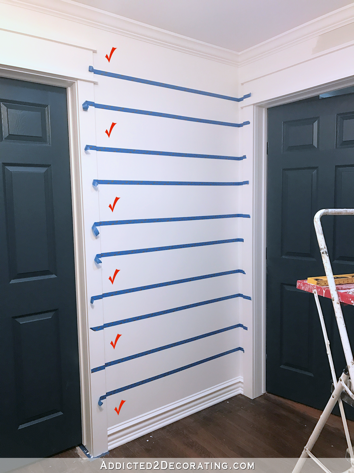 How to paint perfect stripes on a wall - 5 - use painters tape for delicate surfaces to tape off lines