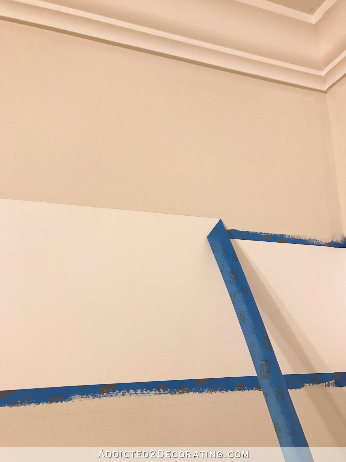 How to paint perfect stripes on a wall - 7 - remove tape by pulling at an angle away from the stripe