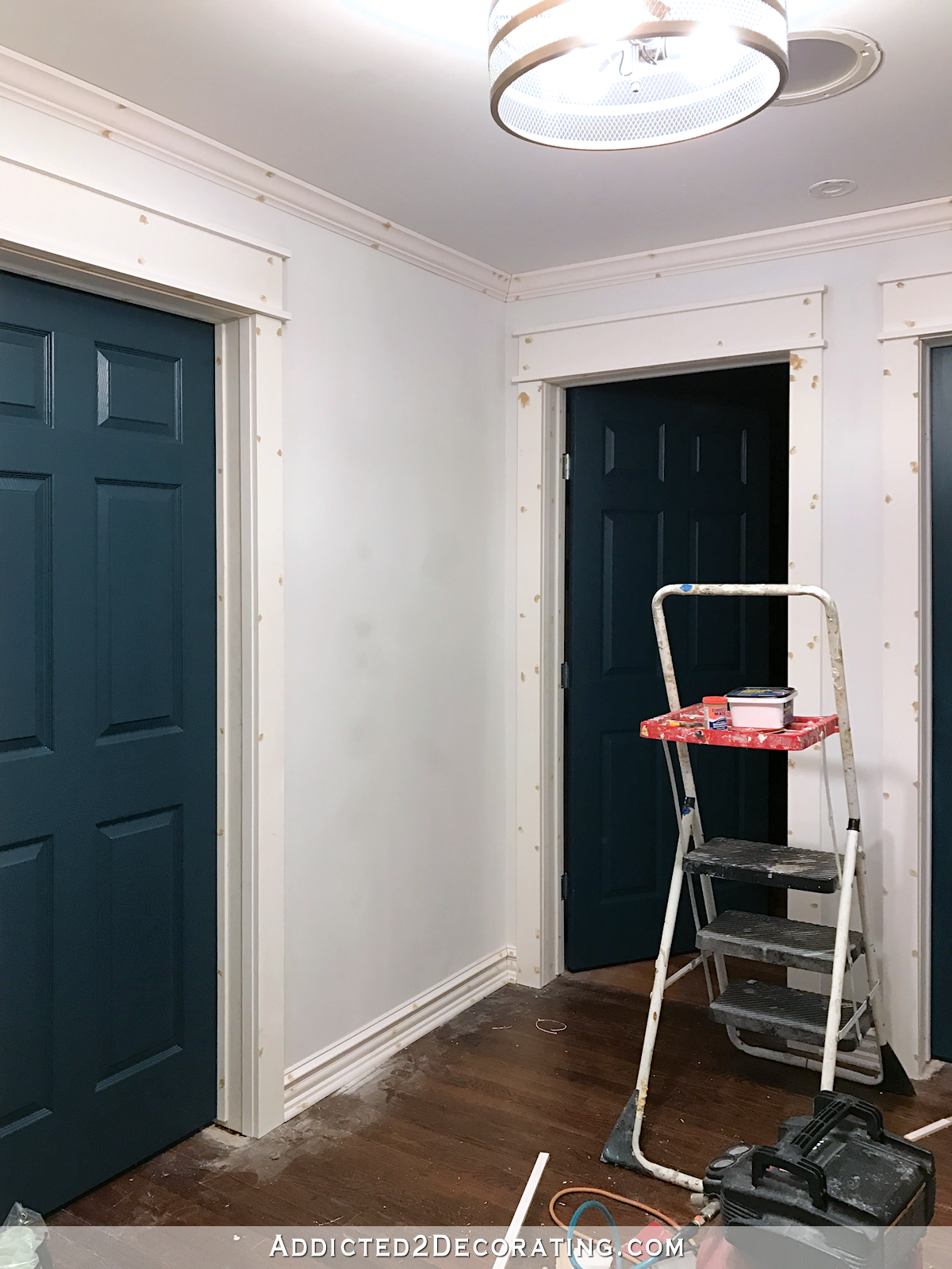hallway all trimmed out -- door casings, baseboards and crown moulding