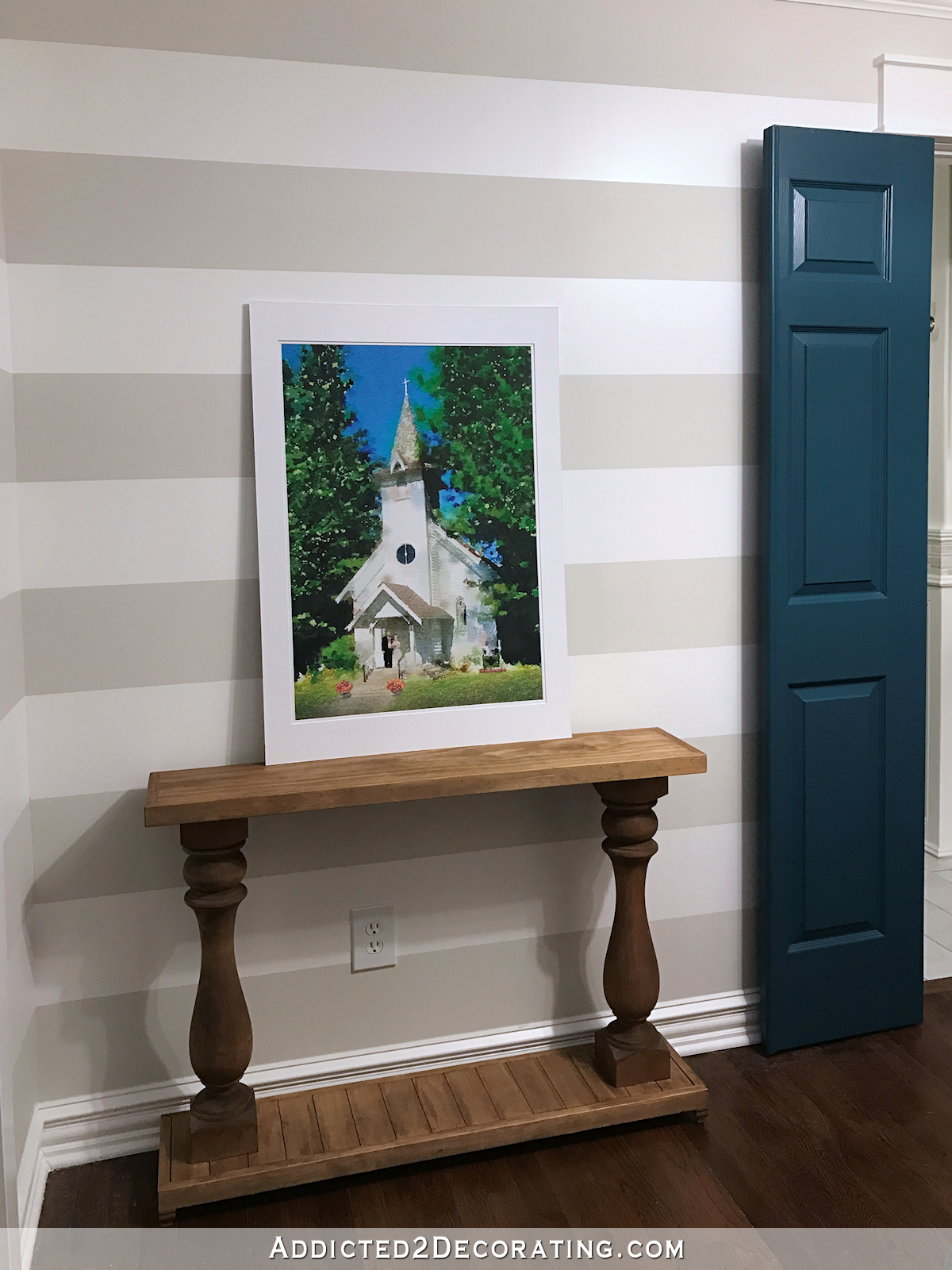 watercolor chapel pic in hallway with console table