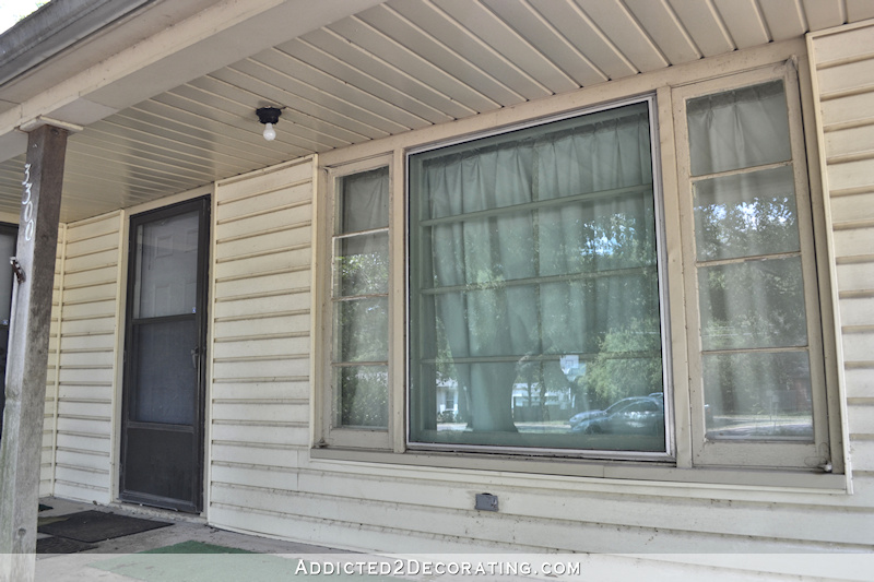 Here's a close-up look at the old vinyl siding on the front porch.